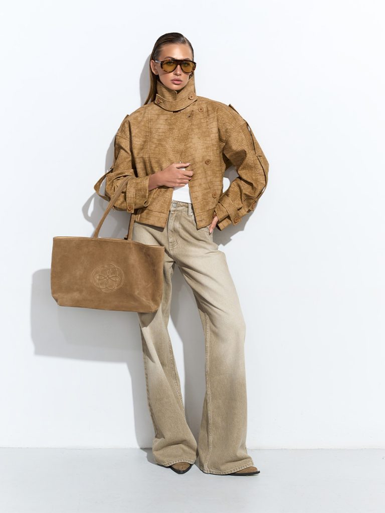 Beige flared jeans with scuffs